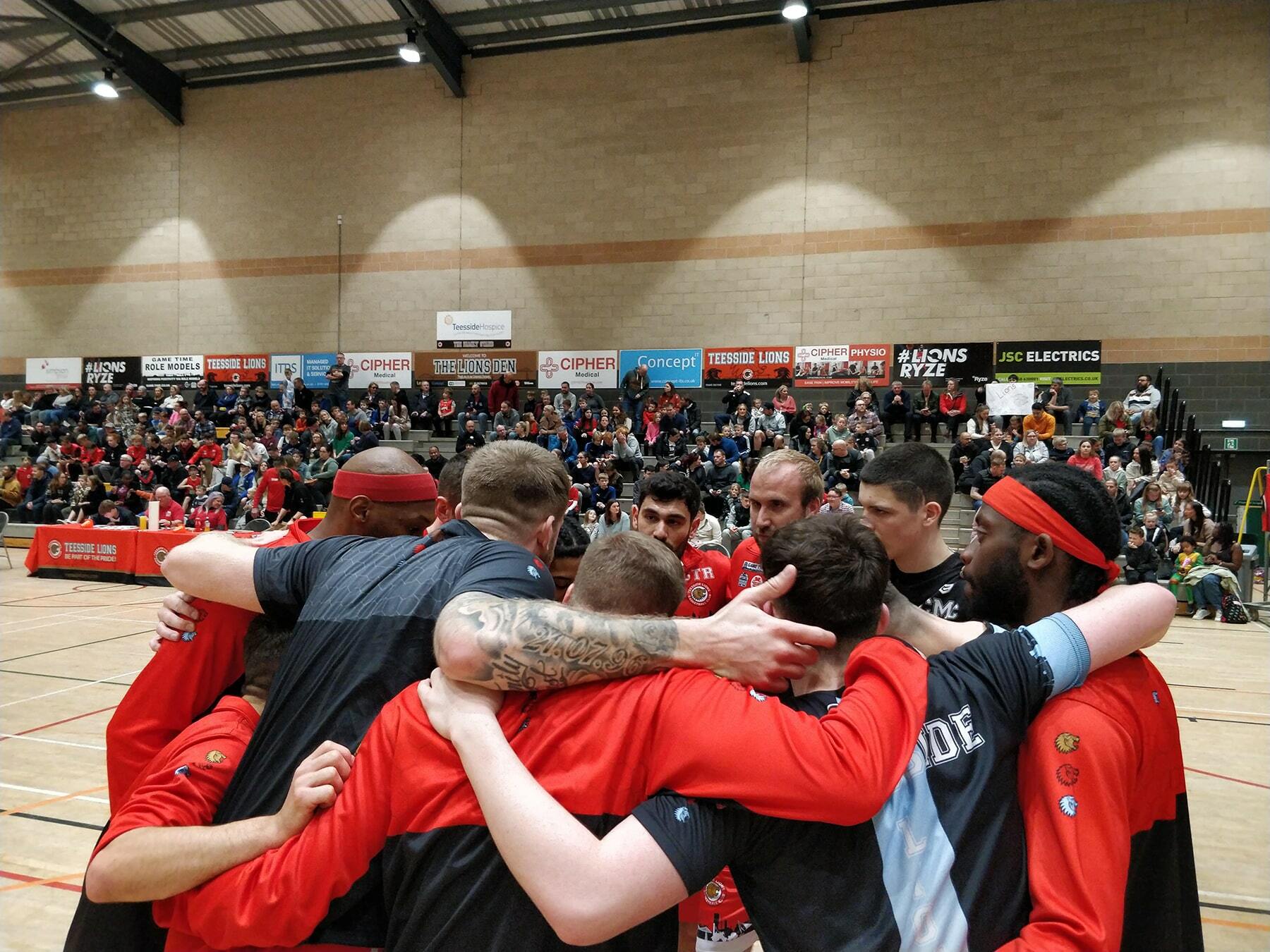 Teesside Lions Team Huddle Big Crowd bg