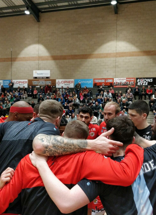 Teesside Lions Team Huddle Big Crowd bg