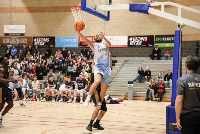 Oliver Hylands completes the reverse lay-up for Lions